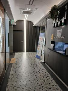a hallway of an office with a sign on the wall at 부산파크호텔 in Busan