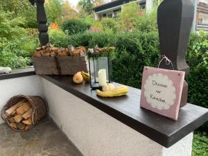 a bench with a sign that says disregard your memory at Seelenbaumlerin in Schliersee
