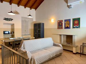 a living room with a couch and a fireplace at Varenna Boulevard in Varenna