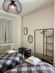 a bedroom with a bed and a mirror at Varenna Boulevard in Varenna