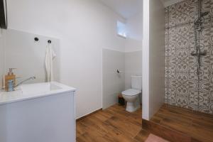 a bathroom with a sink and a toilet at Stodola Lesůňky in Lesŭňky +19 photos
