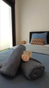 a bed with two pillows on top of it at Villa Hermana Major Luxury Villa in Las Flamencas in San Javier