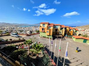 a view of a city with colorful houses at Hotel Belvedere Mindelo, Cabo Verde in Mindelo