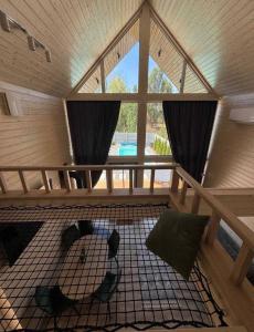 a room with a large window in a sauna at Chill House Dnipro in Dnipro