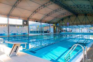 a large swimming pool with blue water at Guest House San Domenico in Augusta +20 photos
