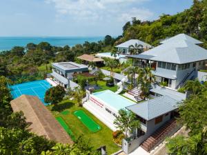 an aerial view of a house with a tennis court at MM Villa Koh Samui in Nathon Bay