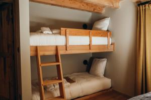 a bunk bed room with two beds in it at Les Framboisiers by Lodji in Saint-Marcel