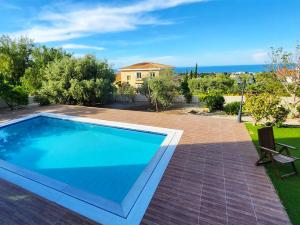 a swimming pool in the backyard of a villa at Villa Amazing by HolidayKeys in Kyrenia +13 photos