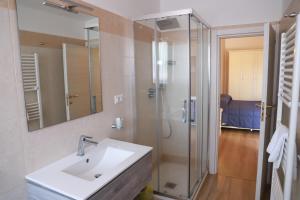 a bathroom with a sink and a shower at Hotel Massimino in Anguillara Sabazia +30 photos