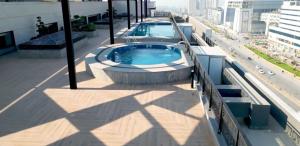 a swimming pool on the roof of a building at Executive 2BHK in Zeta Mall in Islamabad