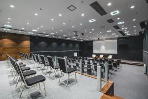 a conference room with chairs and a projection screen at Avala Resort & Villas in Budva +57 photos