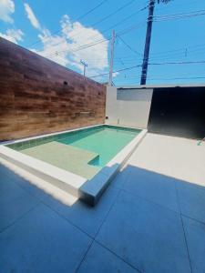 a swimming pool on the roof of a house at Espaço Viva Guarujá in Guarujá