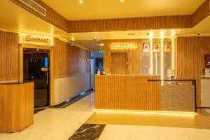 a lobby with a reception desk in a building at Regal Peninsula Hotel Formerly New Peninsula Hotel Ghubaiba Bus Station Bur Dubai in Dubai