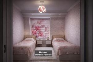 a bedroom with two beds and a painting of roses at Gagarin Luxury Apartment in Samarkand