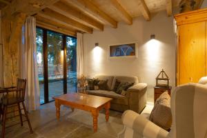 a living room with a couch and a table at Bed & Breakfast De Tol in Sint Annaland