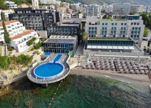 an aerial view of a building with a swimming pool at Avala Resort & Villas in Budva