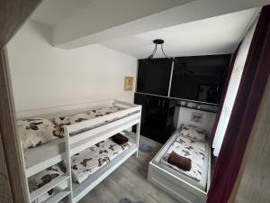 a room with two bunk beds with animals on them at Apartman "Park" in Livno