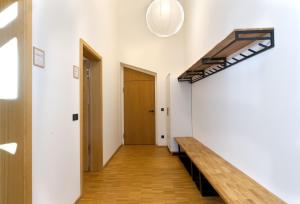 a hallway with a bench and a door at Adlerhorst -410- in Mittenwald