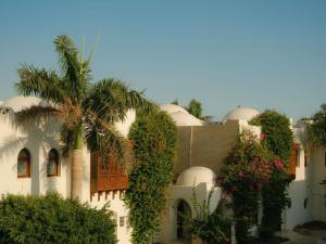a building with plants on the side of it at Movenpick Resort Sharm El Sheikh in Sharm El Sheikh