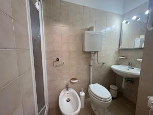 a small bathroom with a toilet and a sink at Hotel San Paolo in Varazze +21 photos