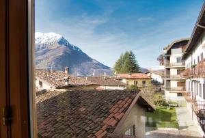 a view of a mountain from a window at Cuor di Barzio P1 in Barzio