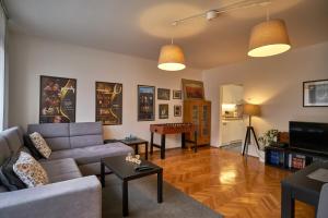 a living room with a couch and a table at Take 5 in Belgrade