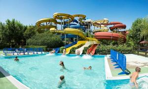 a group of people in a pool at a water park at Maddalena House in Vasto