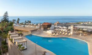 an aerial view of a resort with a swimming pool and the ocean at AluaSoul Orotava Valley - Adults Only in Puerto de la Cruz +59 photos
