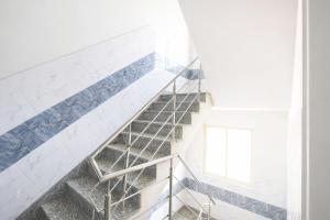 a staircase in a house with blue and white tiles at FabHotel Resto Relax in New Delhi +23 photos