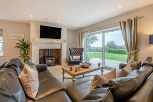 a living room with a couch and a fireplace at 4 Bed in Catterick oc-y33625 in Catterick Bridge