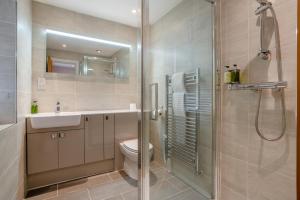 a bathroom with a shower and a toilet and a sink at 4 Bed in Catterick oc-y33625 in Catterick Bridge +24 photos