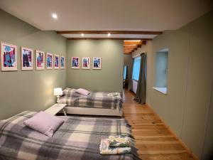 a room with two beds and a hallway at Cottage in Kleinmachnow