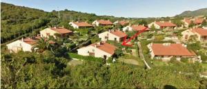 a small village with houses on a hill at Villa Silvia in Costa Rei
