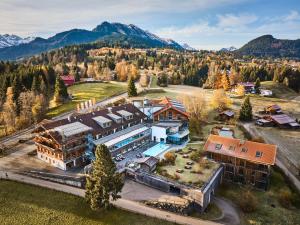 an aerial view of a resort with mountains in the background at Hotel Oberstdorf in Oberstdorf