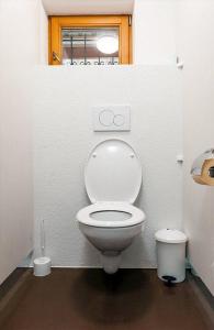 a bathroom with a white toilet in a stall at Chata Malino in Ružomberok +12 photos
