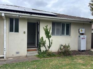 a house with a solar panel on top of it at Guest ensuite room with private entrance in Melbourne