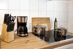 a kitchen counter with two pots on a stove at Quartier VierGlück in Marl