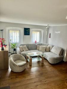 a living room with a couch and a coffee table at Magiczny Domek in Podgórzyn