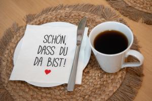 a cup of coffee and a napkin with a sign shown class did da best at Quartier VierGlück in Marl +9 photos