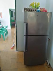 a stainless steel refrigerator in a kitchen at punta bolivar in San Antero
