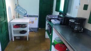 a kitchen with a stove and a counter top at punta bolivar in San Antero