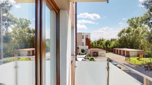 an open balcony with a view of a building at Studio Fibra Macchiato in Rybnik