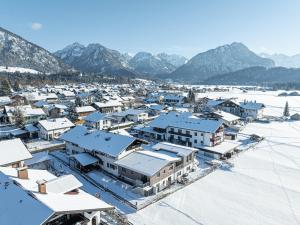an aerial view of a town in the snow at Alma Hotel Oberstdorf in Oberstdorf +28 photos