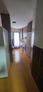 a kitchen with white appliances and a tile floor at Plaza de la Cruz, 2 in Cazalegas +9 photos