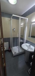 a bathroom with a shower and a sink at Plaza de la Cruz, 2 in Cazalegas