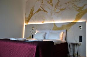 a bedroom with a bed with a map on the wall at ProfilHotels Halmstad Plaza in Halmstad +89 photos
