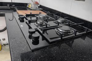 a black stove top oven in a kitchen at Younis chalet in Dahab