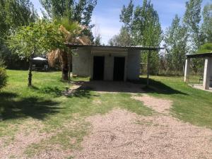 a small building in the middle of a field at Lujan de Cuyo Mendoza in Ciudad Lujan de Cuyo