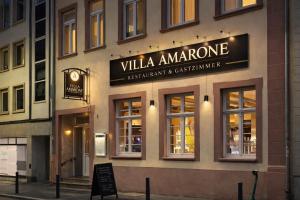 a building with a sign that reads villa amore at Villa Amarone in Mannheim