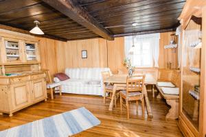 a living room with a table and a white couch at Haunzwickl Ferienhaus in Mürzzuschlag +33 photos